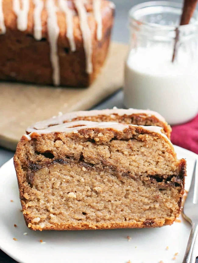 a Gluten Free Cinnamon Swirl Bread with a glass of milk